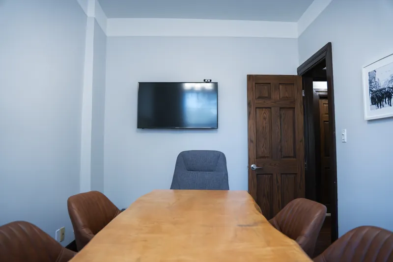 Boardroom with live-edge table and display