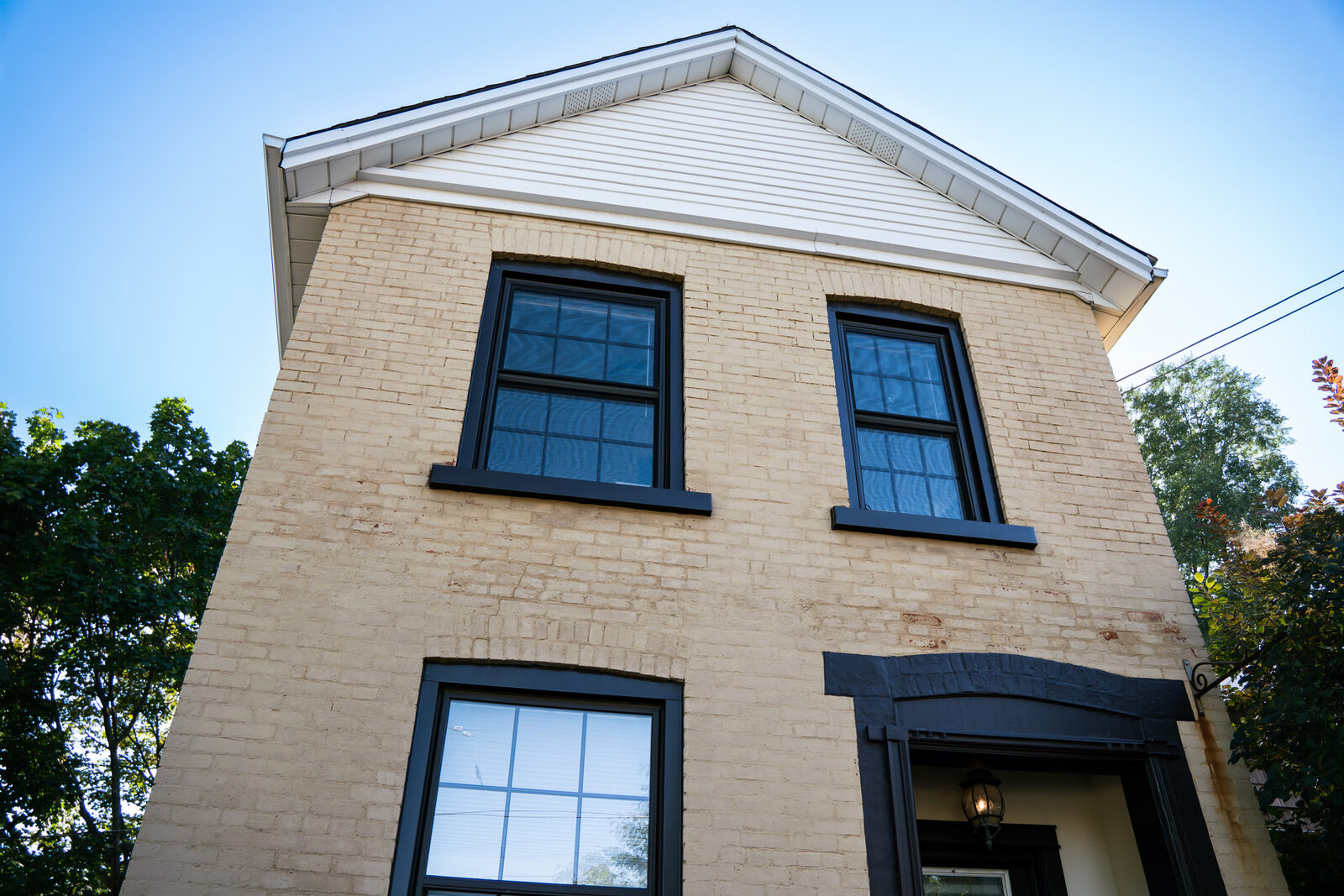 19 Court Street brick office building against a clear sky